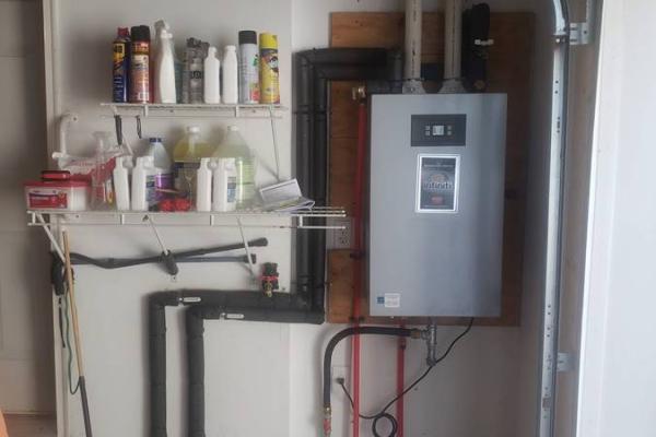 Tankless hot water heater installation by Applause Plumbing in Tatamy, PA. Optimizing space and energy efficiency, our service ensures a constant supply of hot water in garages. Expert insulation safeguards against temperature fluctuations, offering reliable and tailored solutions for your specific needs.