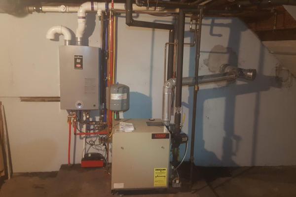 Tankless hot water system installation by Applause Plumbing and Heating in Easton, PA. Energy-efficient and space-saving solution for continuous hot water. Expert plumbing service for homes in Easton, PA. Contact us for reliable tankless water heater installation and maintenance. 