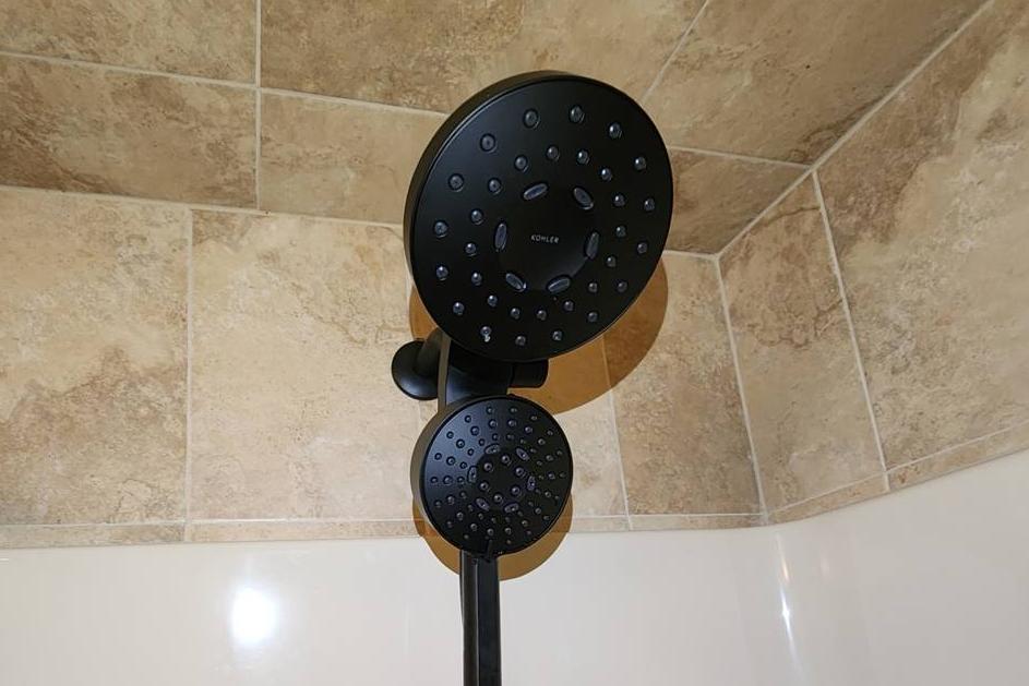 Installed dual shower head and handheld shower wand in a bathroom in Easton, PA, featuring modern plumbing fixtures for enhanced functionality.